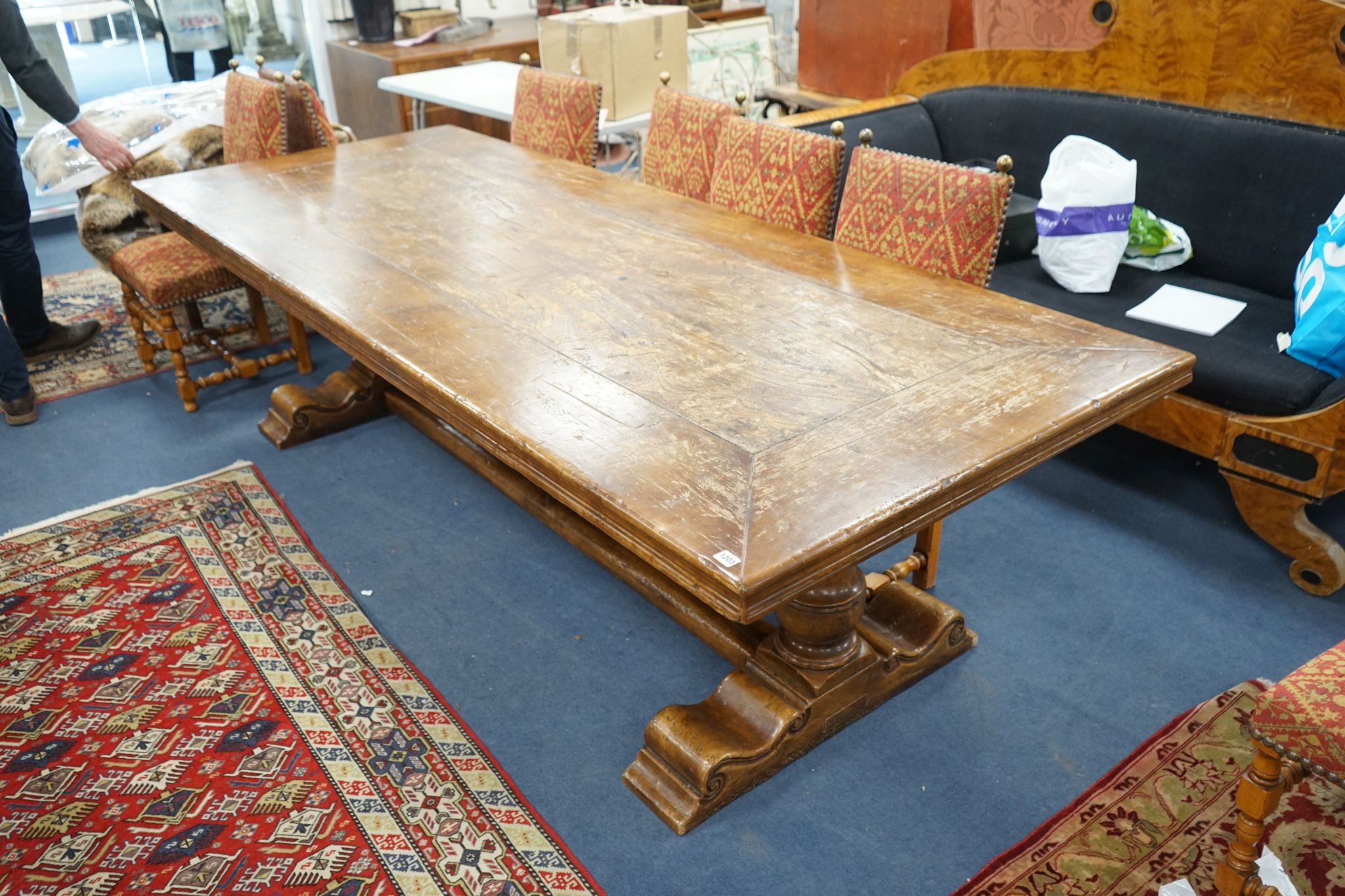 An 18th century style rectangular walnut refectory dining table on baluster end supports with central stretcher, length 270cm, width 106cm, height 76cm